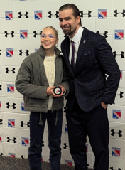 A person and person posing for a pictureAI-generated content may be incorrect.