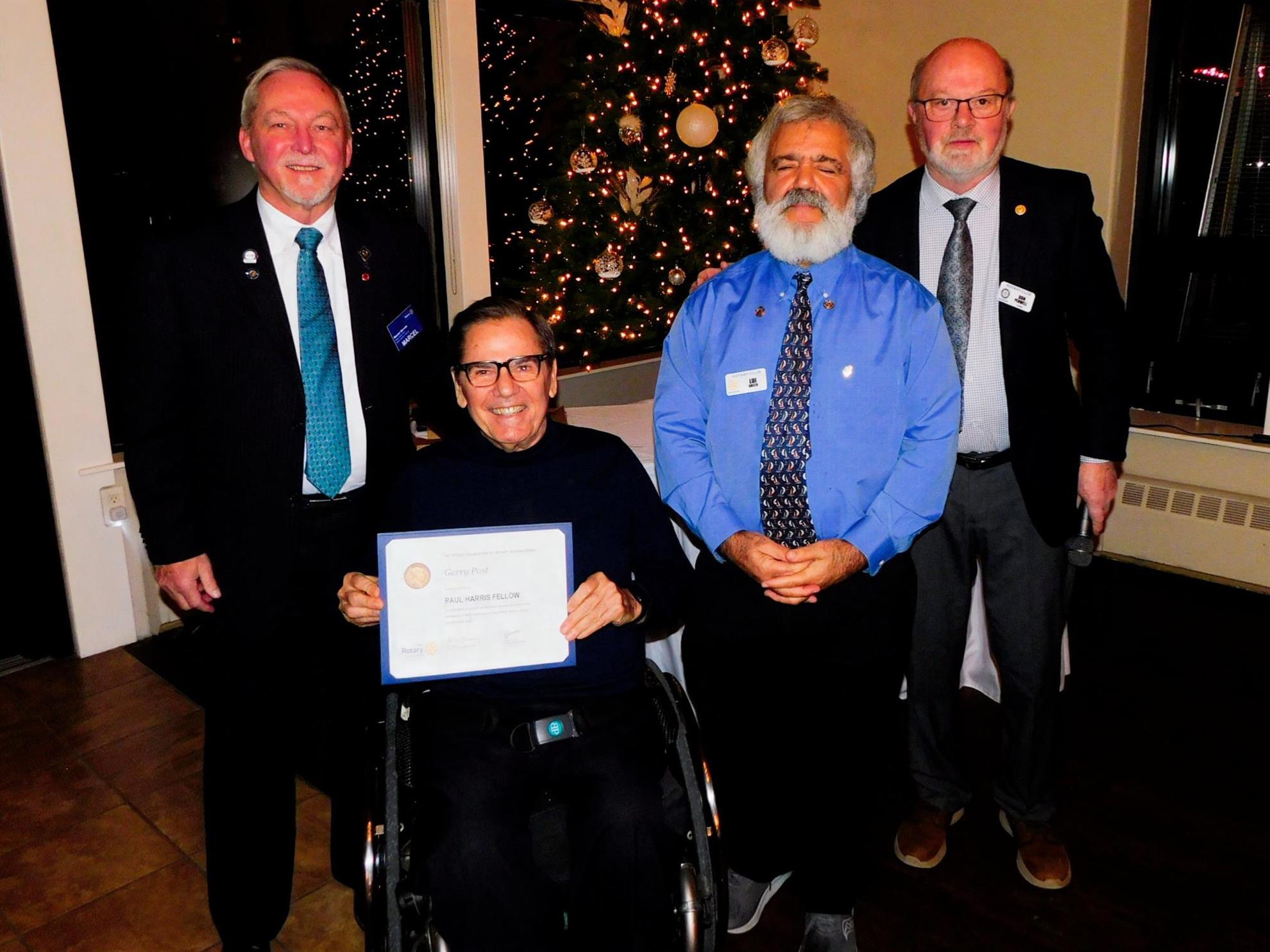 Left to right: Marcel Gervais, Paul Harris Fellow Gerry Post, Lui Greco, and Don Penwell