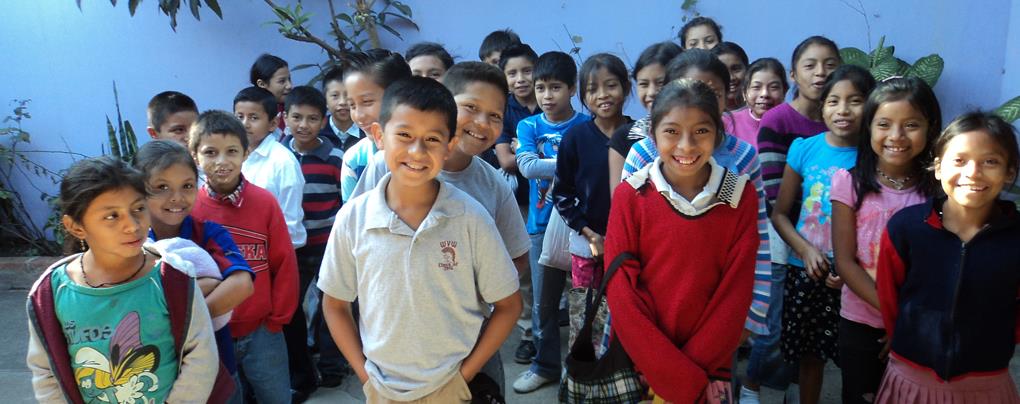 A group of children smilingDescription automatically generated