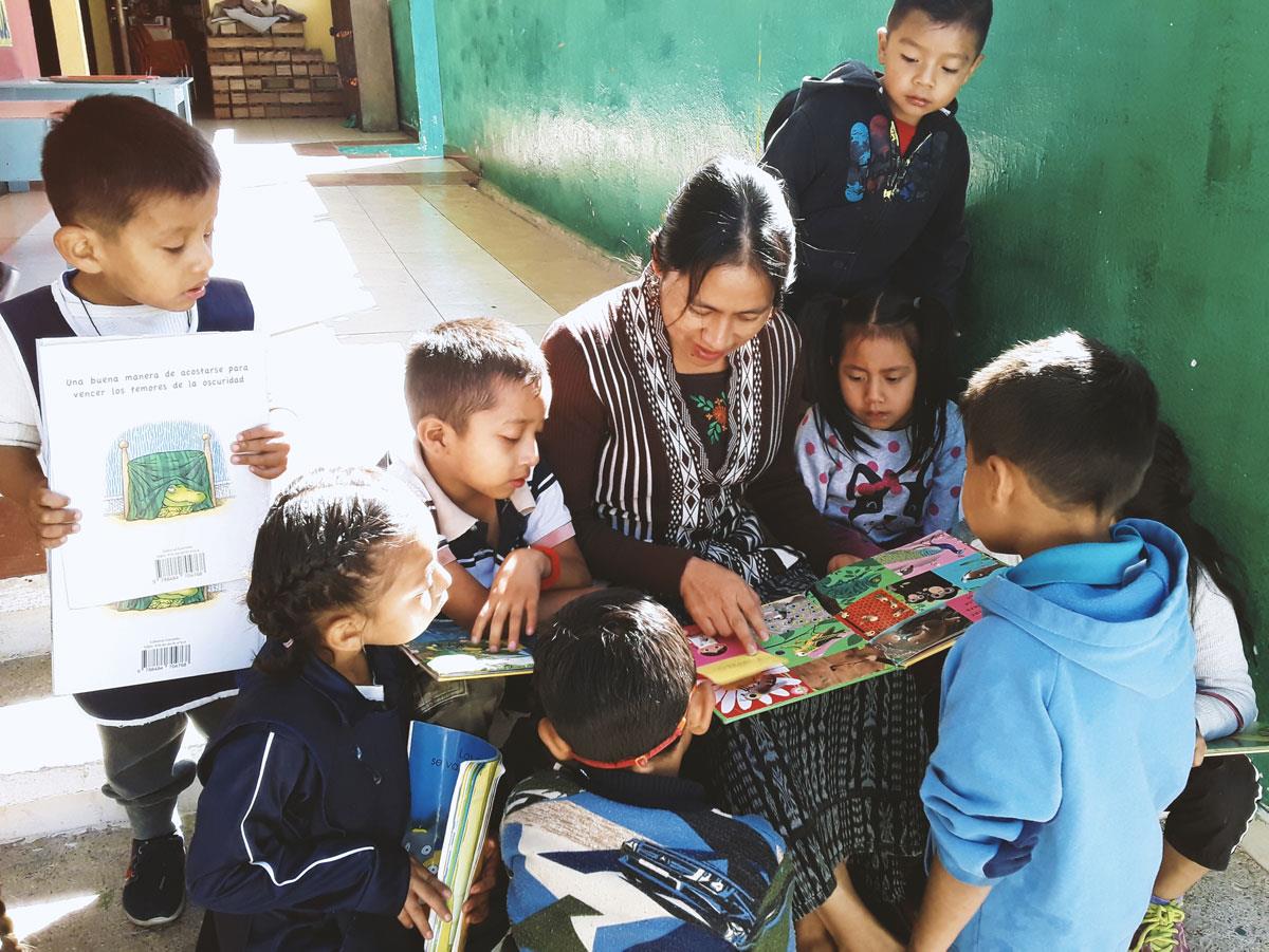 Reading to young Guatemalan children