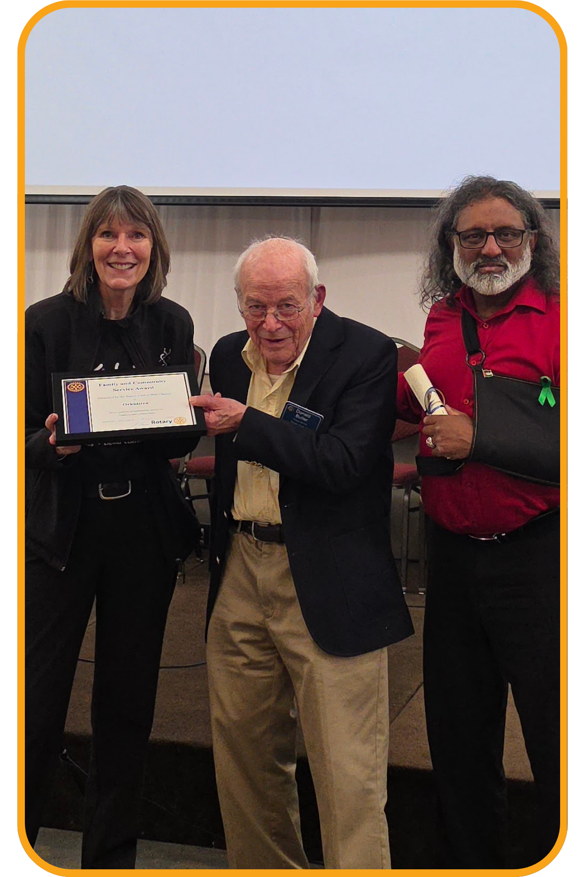Orkidstra receiving the Family and Community Services Award
