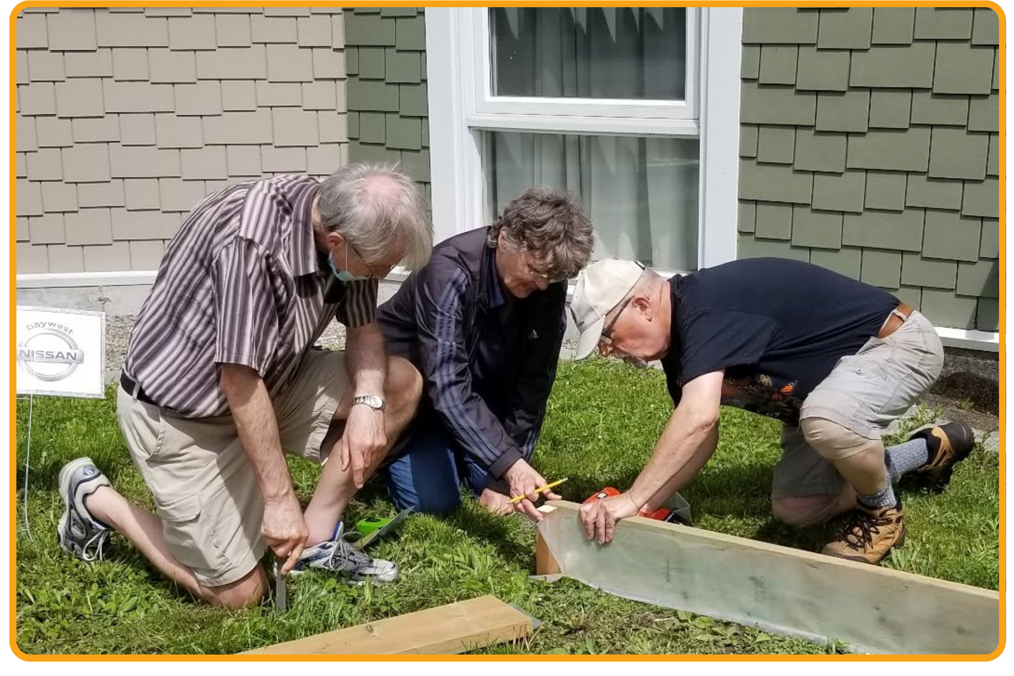 Volunteers building the garden box