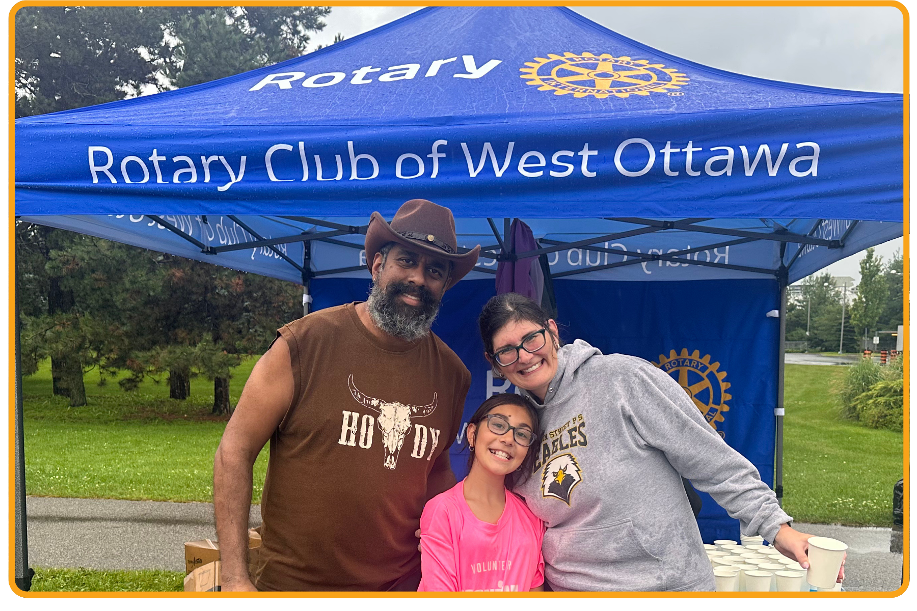 volunteers with Rotary tent
