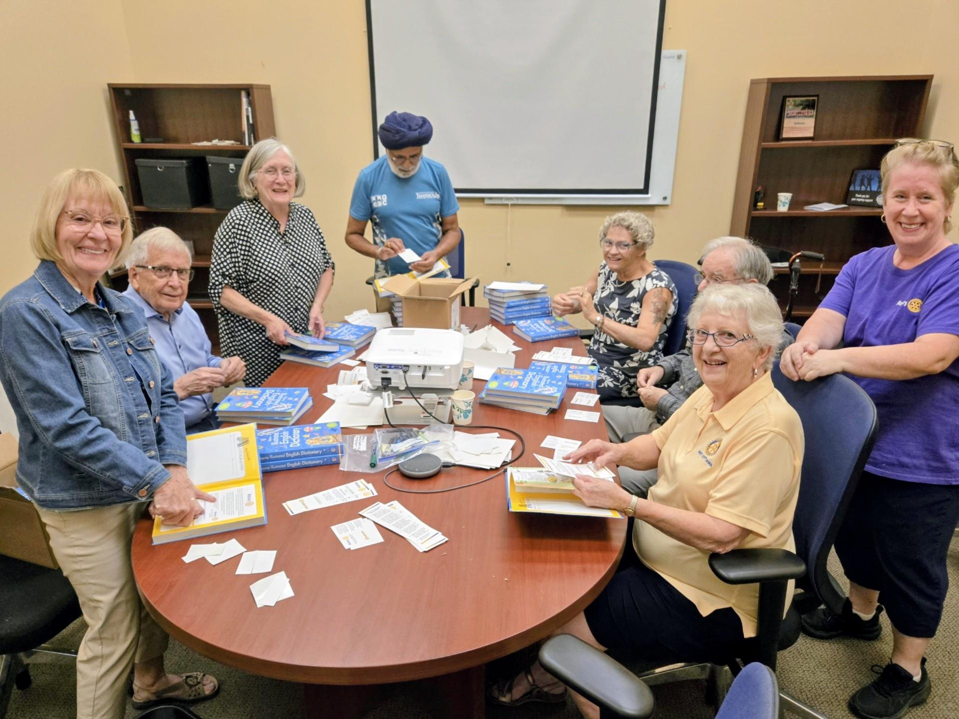 Rotarians adding labels to dictionaries