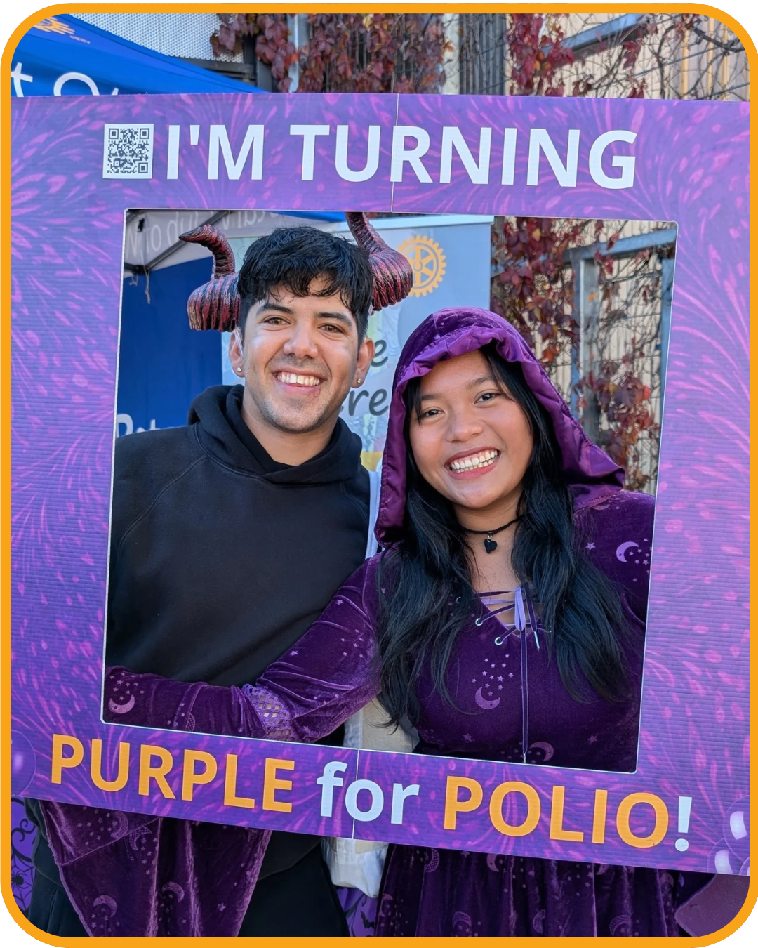 Halloween participants posing in the Purple for Polio photo frame