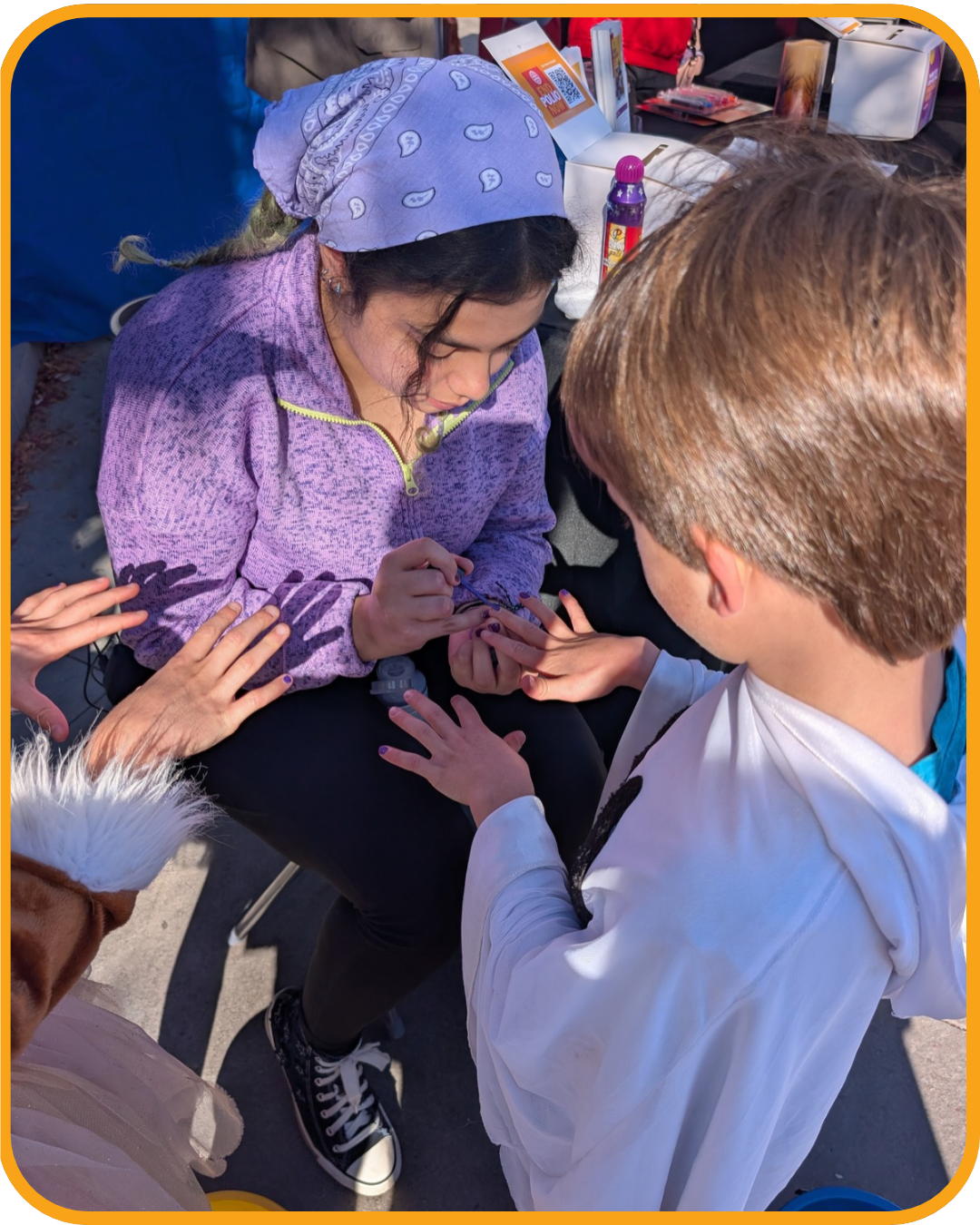 Volunteer painting a child's fingernail purple for polio awareness