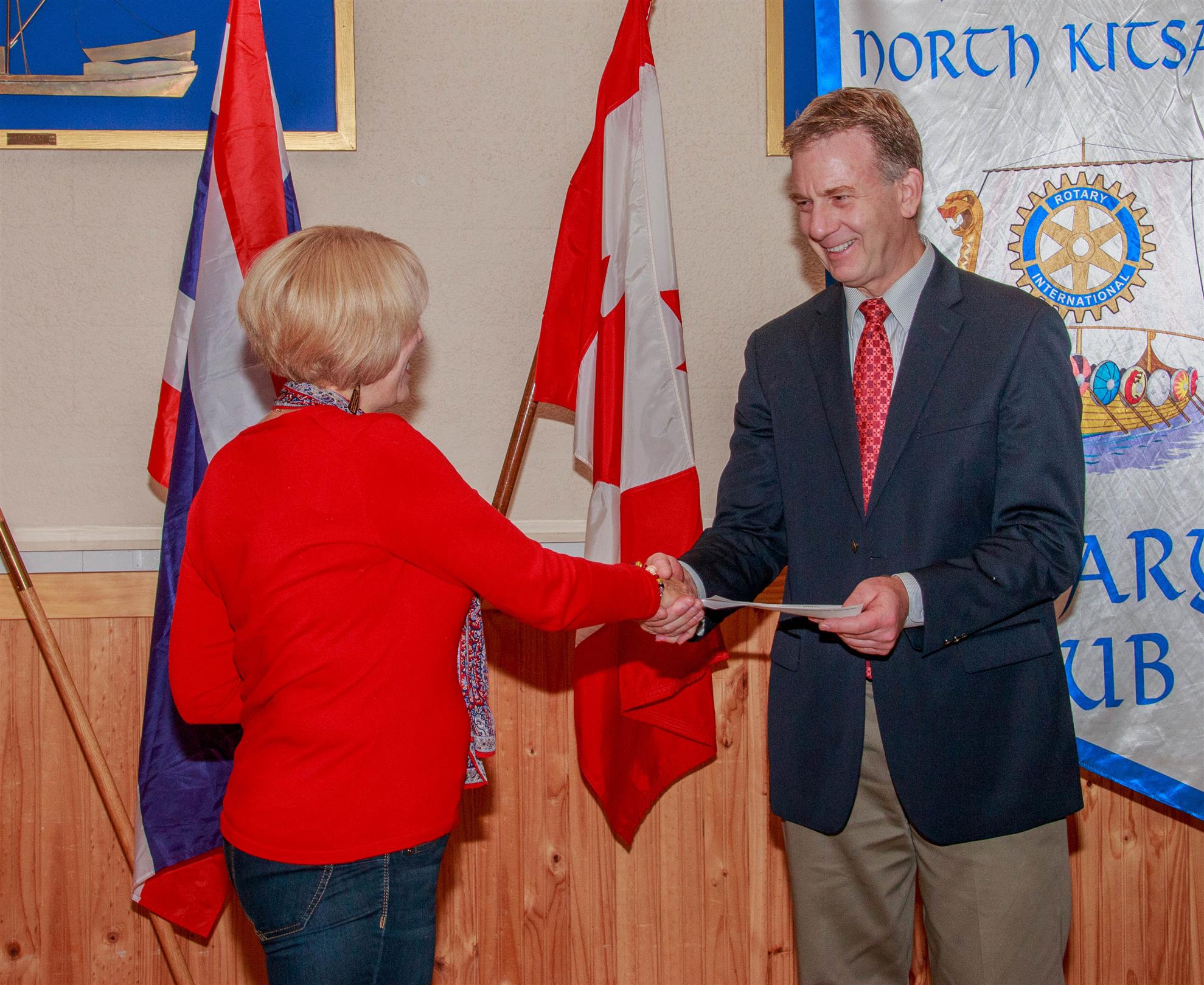 Dr. Paul Kremer receives check