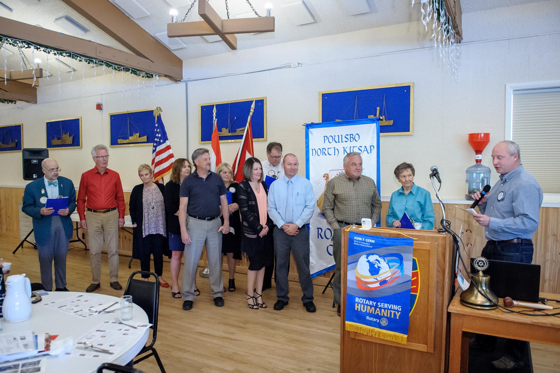 new members, Don Russell, Ray Donahue, Bob Hill and Jim Nall as their spouses and sponsors look on