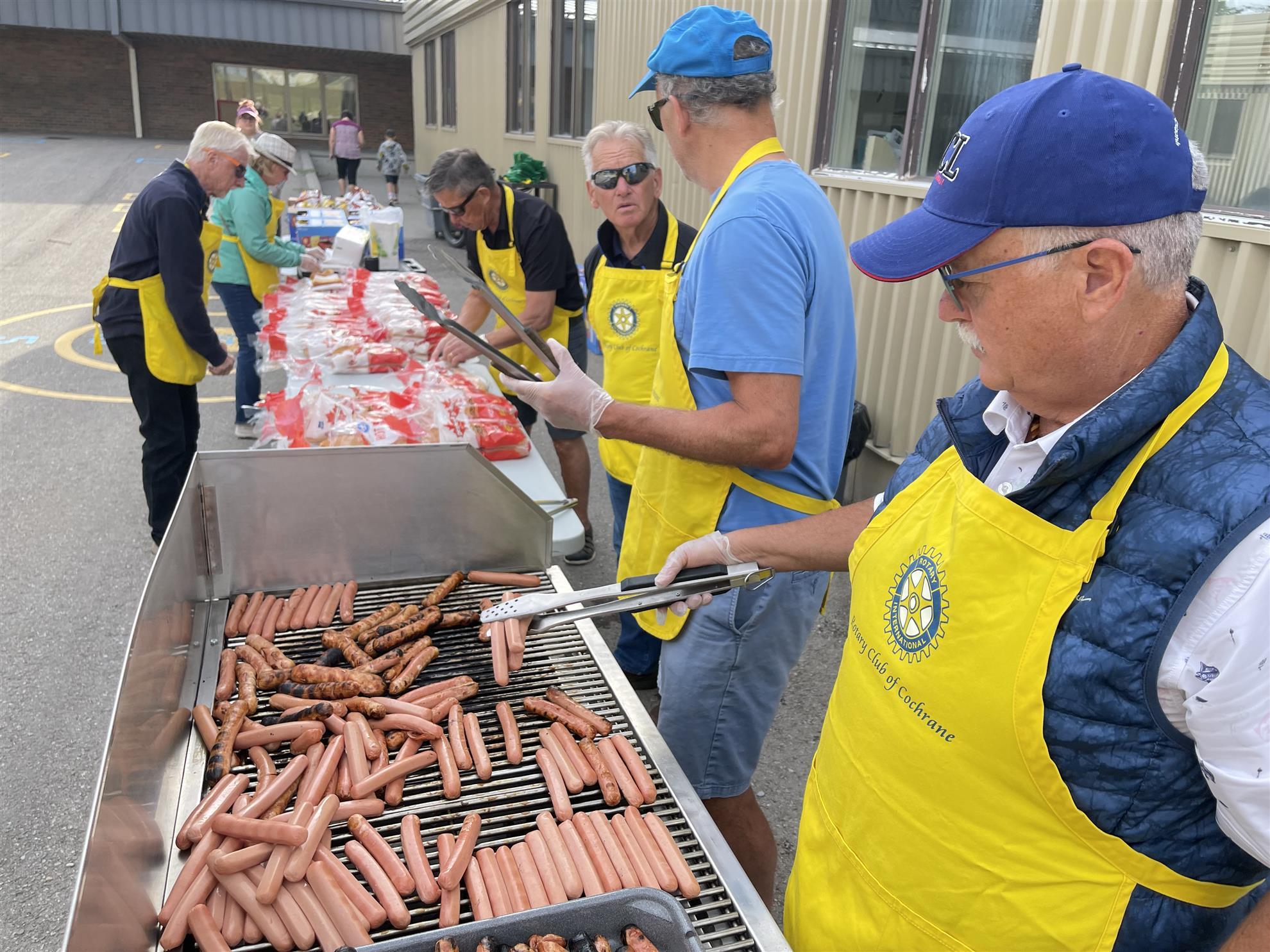 Serving Hot Dog Lunch at Glenbow School 2024 -a