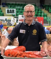 President Lee Hanson presents the large lobster