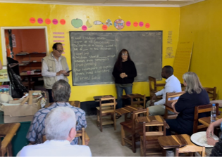 A group of people in a classroom

AI-generated content may be incorrect.