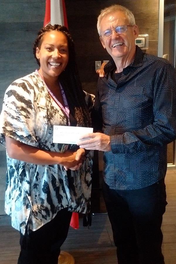 RCOS President Alex Davidson presents Clarissa Arthur of Education Foundation of Ottawa with a cheque.