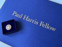 A blue box with a coin in itDescription automatically generated