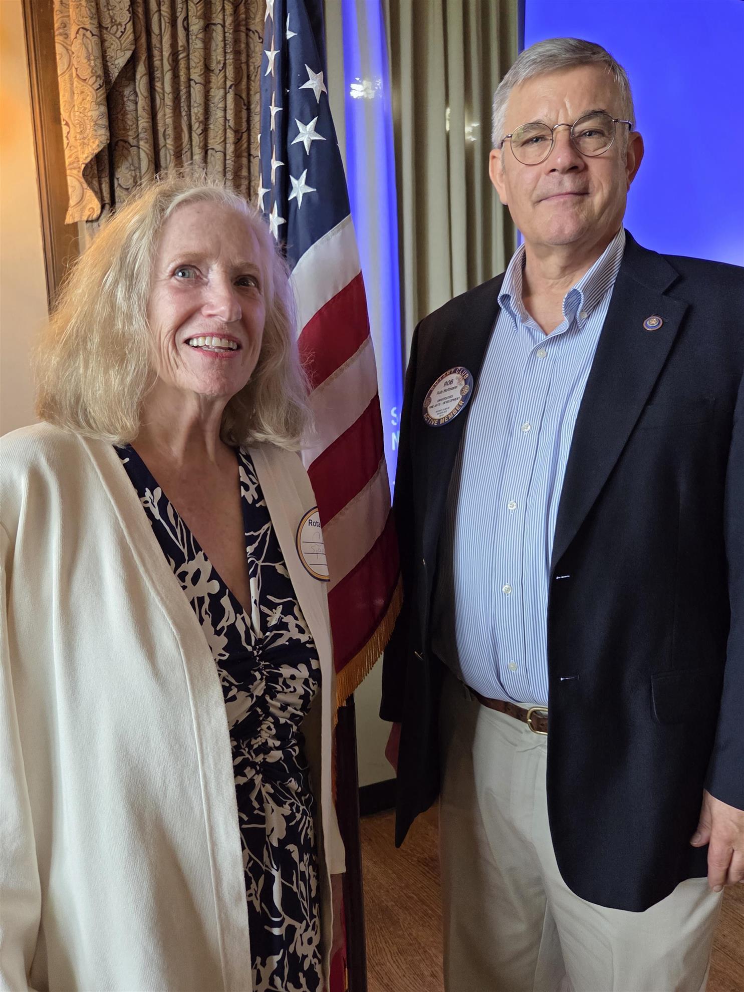 A person and person standing next to each otherAI-generated content may be incorrect.