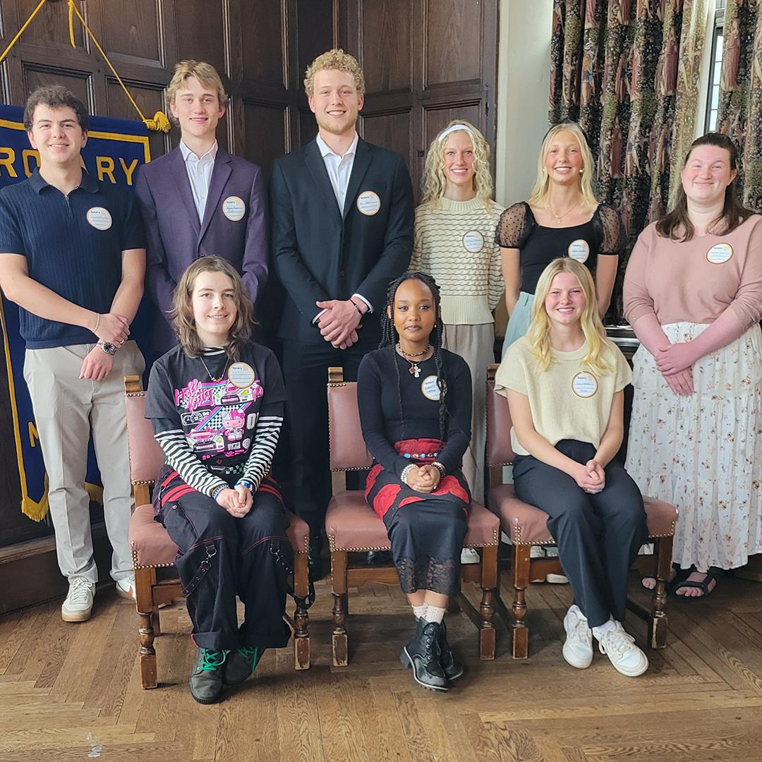 A group of people posing for a photoAI-generated content may be incorrect.