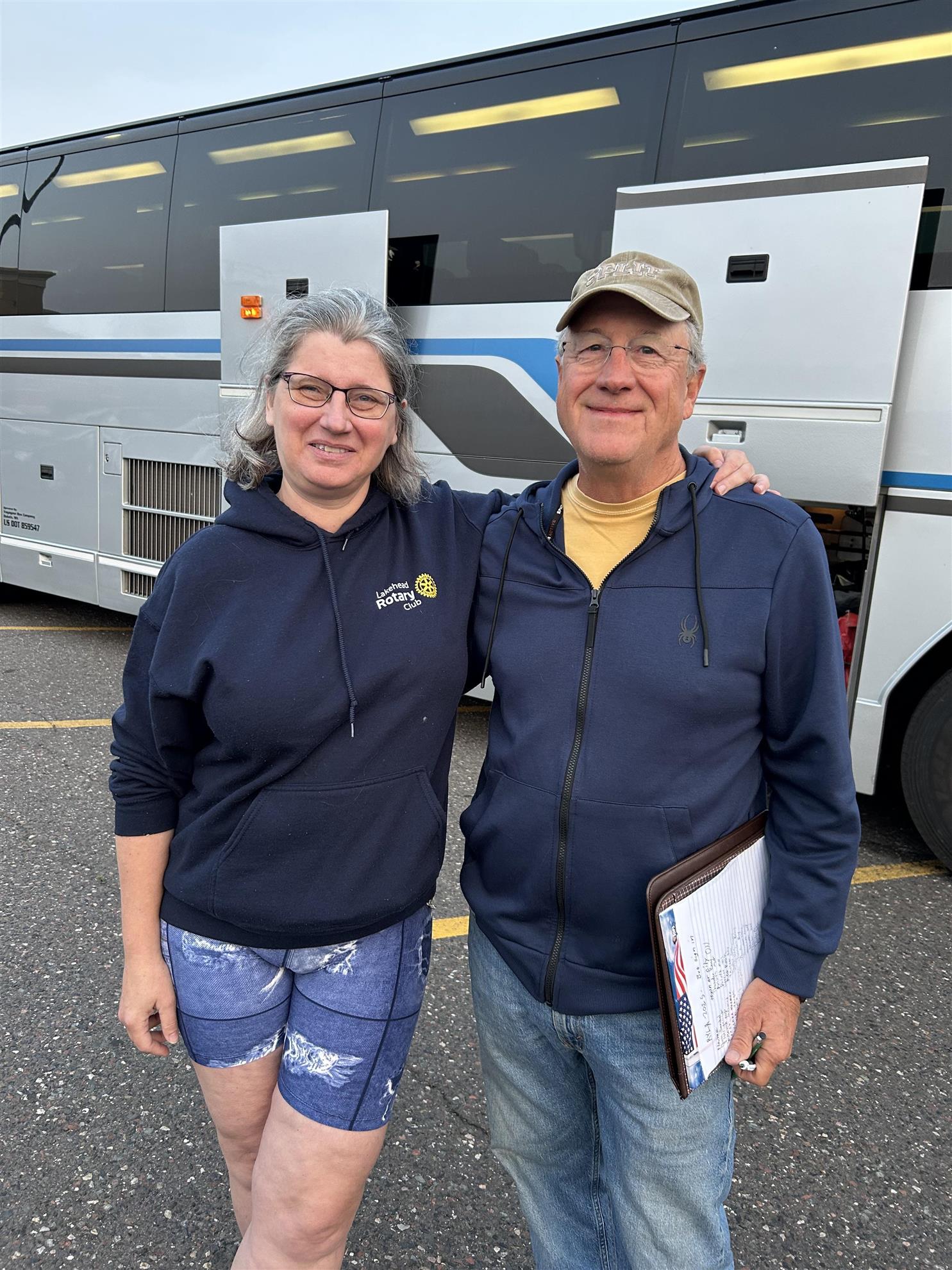 A person and person standing in front of a truckAI-generated content may be incorrect.