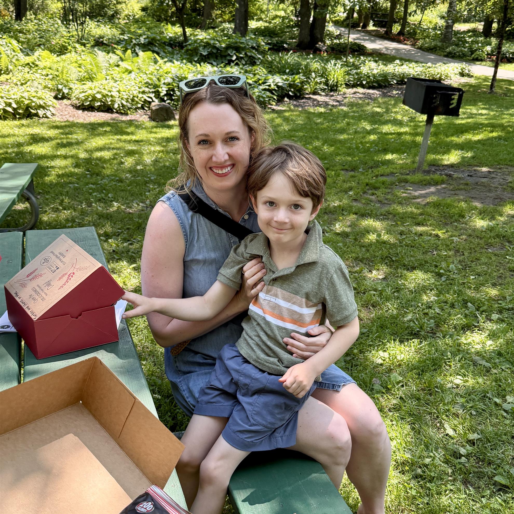 A person holding a child on her lapAI-generated content may be incorrect.