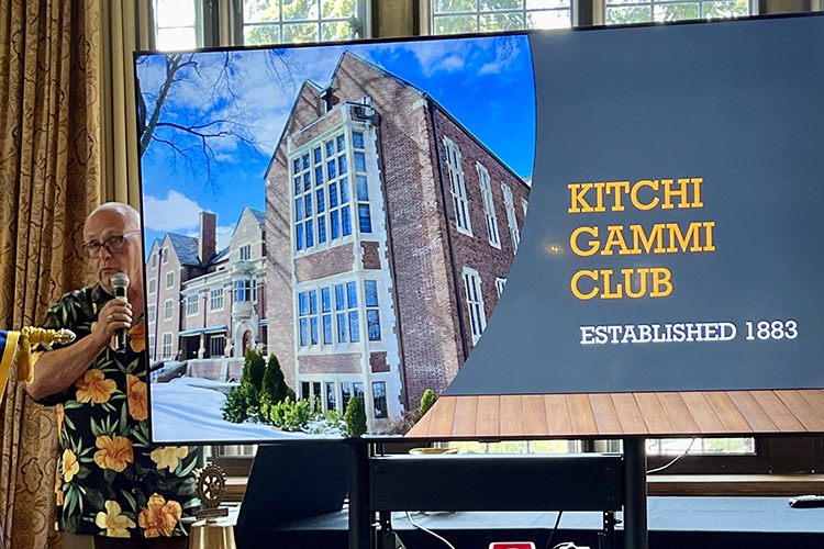 A large screen with a picture of a buildingDescription automatically generated