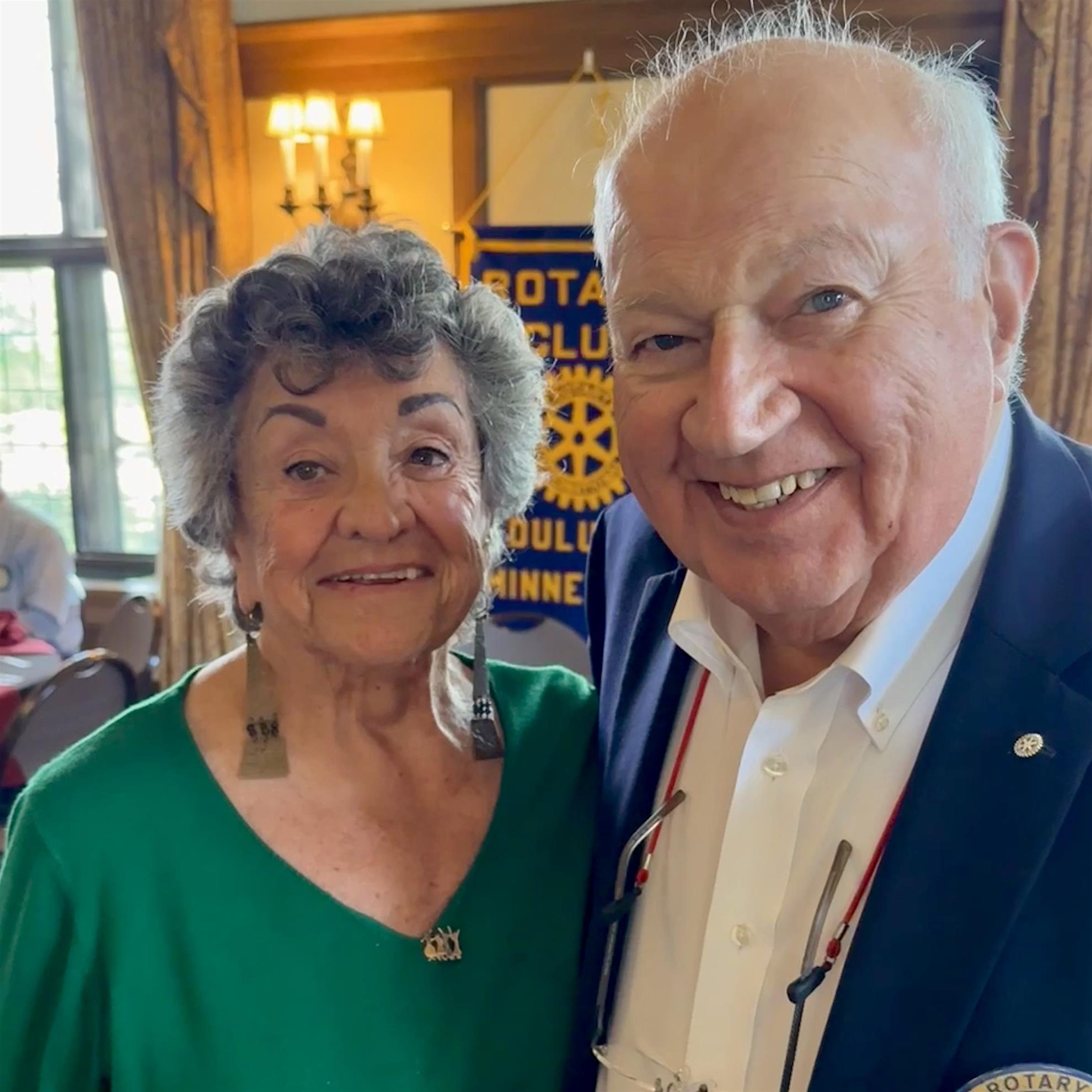 A person and person posing for a pictureAI-generated content may be incorrect.