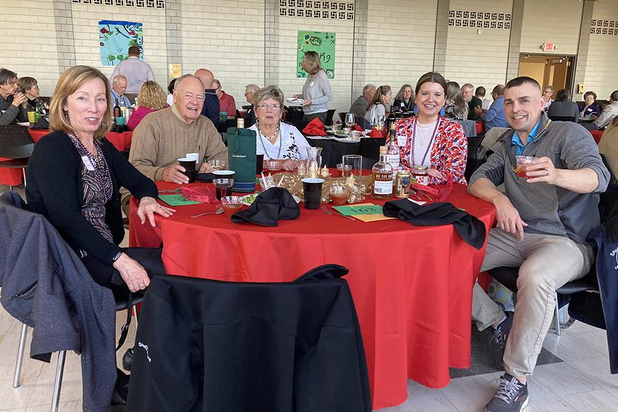 A group of people sitting at a tableDescription automatically generated