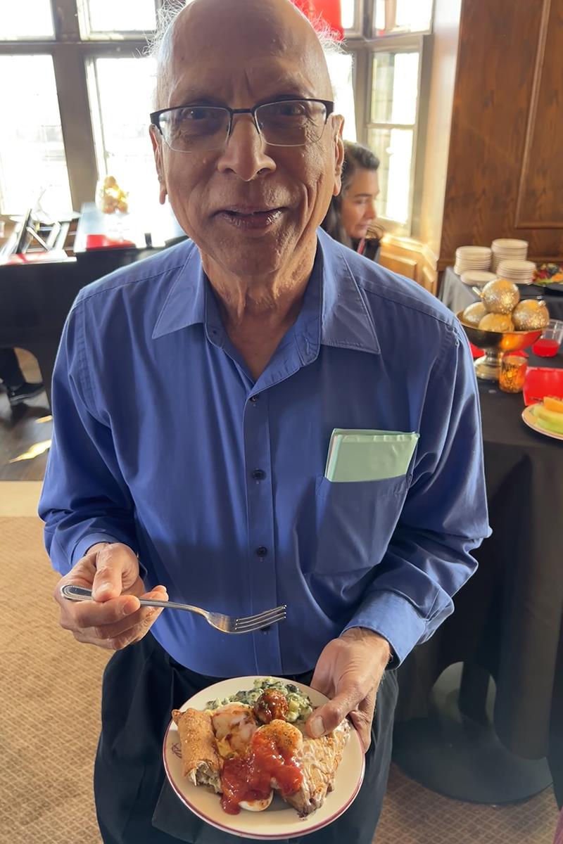 A person holding a bowl of foodDescription automatically generated