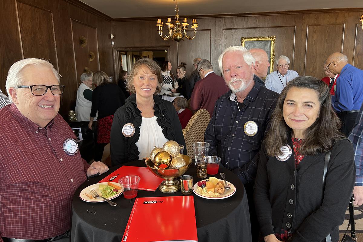 A group of people posing for a photoDescription automatically generated