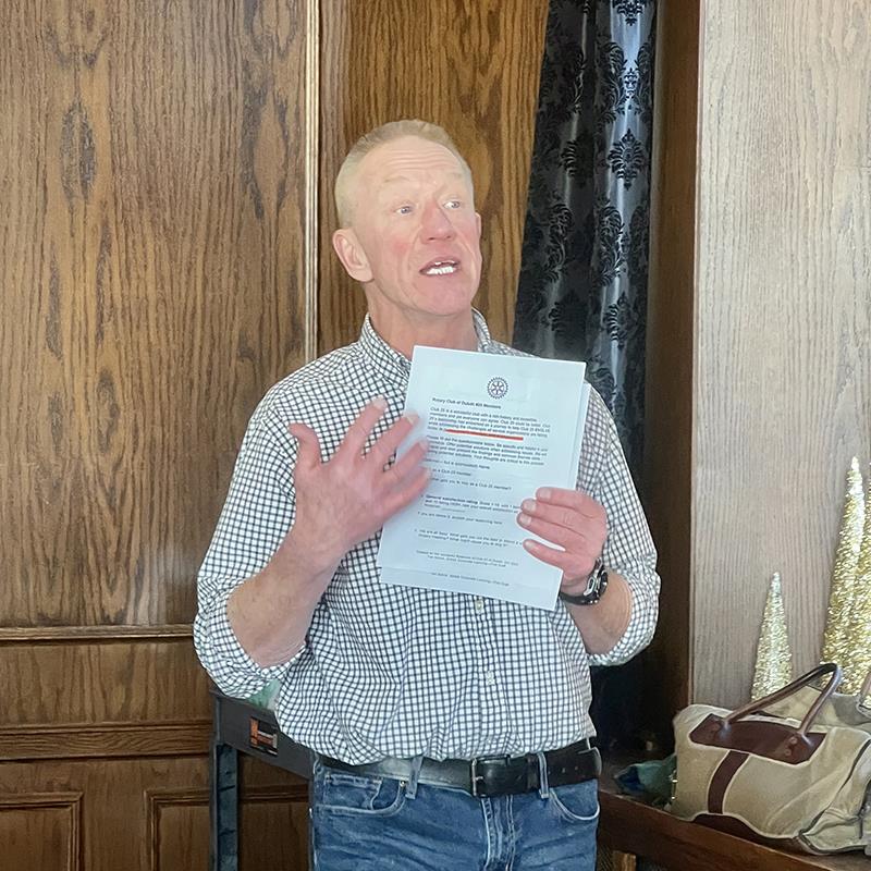 A person holding a piece of paperDescription automatically generated