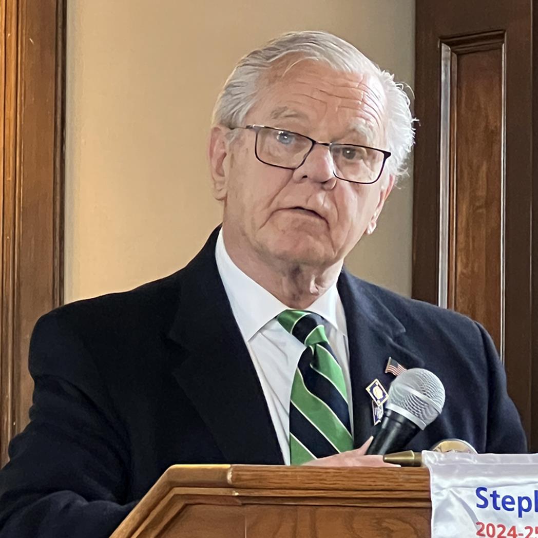 A person standing at a podiumAI-generated content may be incorrect.