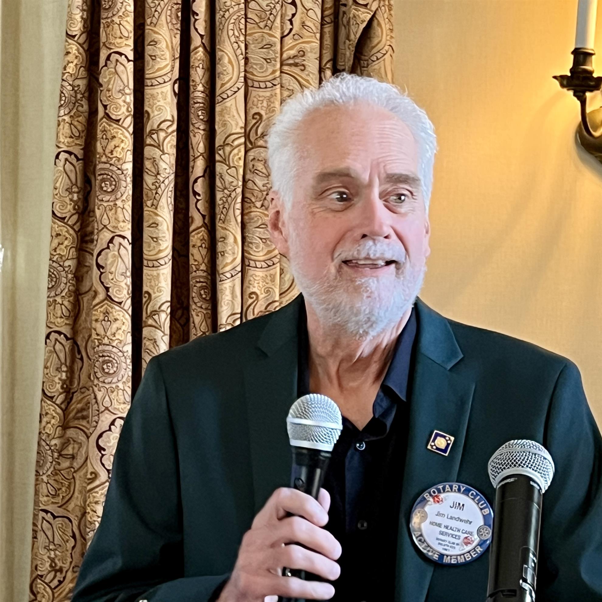 A person holding two microphonesAI-generated content may be incorrect.