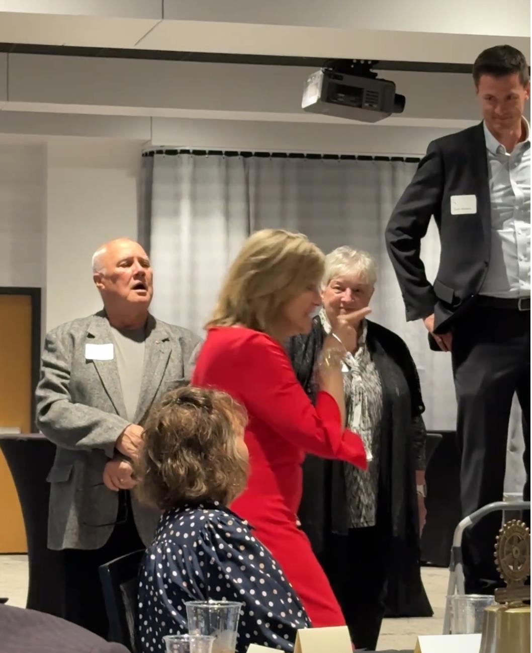 A person lying on a mattress in front of a projector screenAI-generated content may be incorrect.
