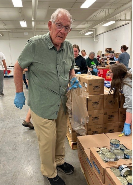 An old person in a warehouseAI-generated content may be incorrect.