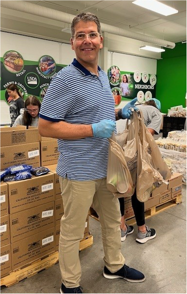 A person wearing gloves holding plastic bagsAI-generated content may be incorrect.