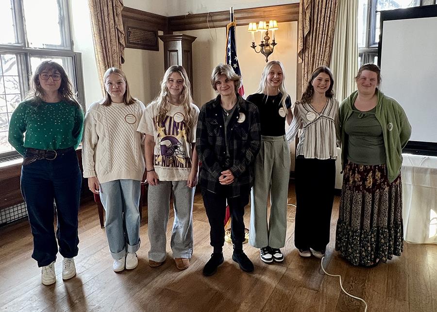 A group of people posing for a photoDescription automatically generated