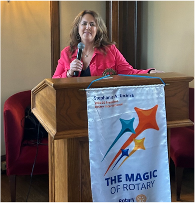 A person sitting at a podiumAI-generated content may be incorrect.