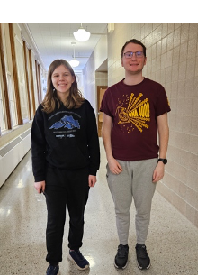 A person and person standing in a hallwayAI-generated content may be incorrect.