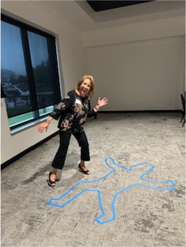 A person standing in front of a blue line drawn on the floorAI-generated content may be incorrect.