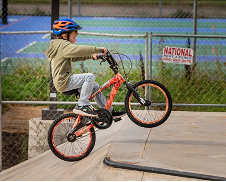 A child riding a bikeAI-generated content may be incorrect.