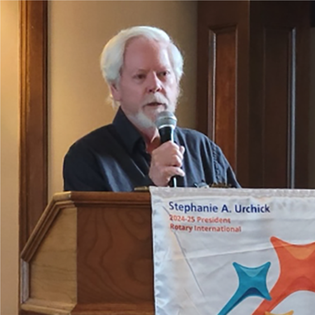 A person speaking into a microphoneAI-generated content may be incorrect.