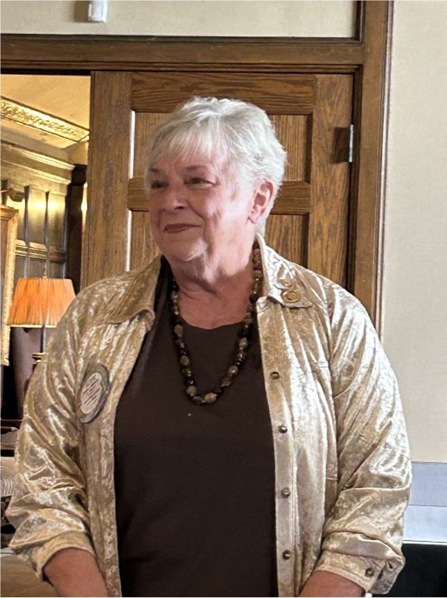 A person in a gold jacketAI-generated content may be incorrect.