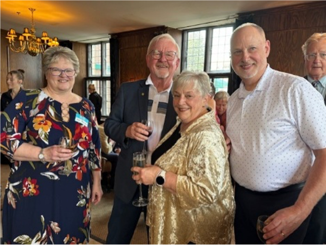 A group of people posing for a photoAI-generated content may be incorrect.