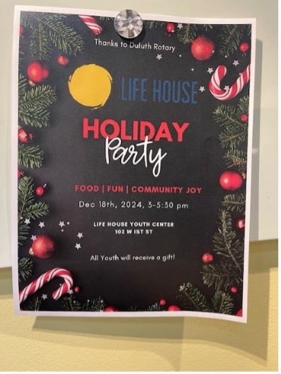 A poster on a wallDescription automatically generated