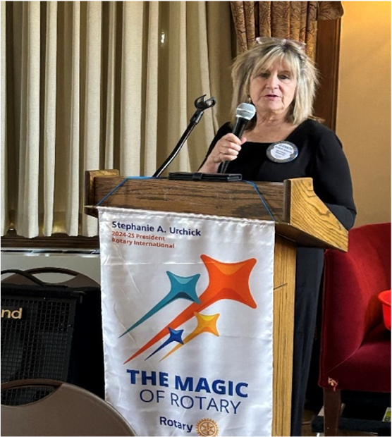 A person speaking into a microphoneAI-generated content may be incorrect.