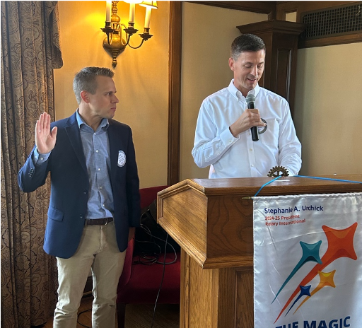 A person standing in front of a podium with a microphoneAI-generated content may be incorrect.