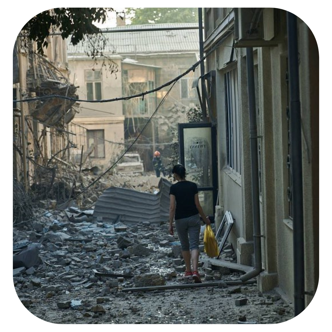 Odessa, Ukraine - Photo of woman walking amongst rubble.