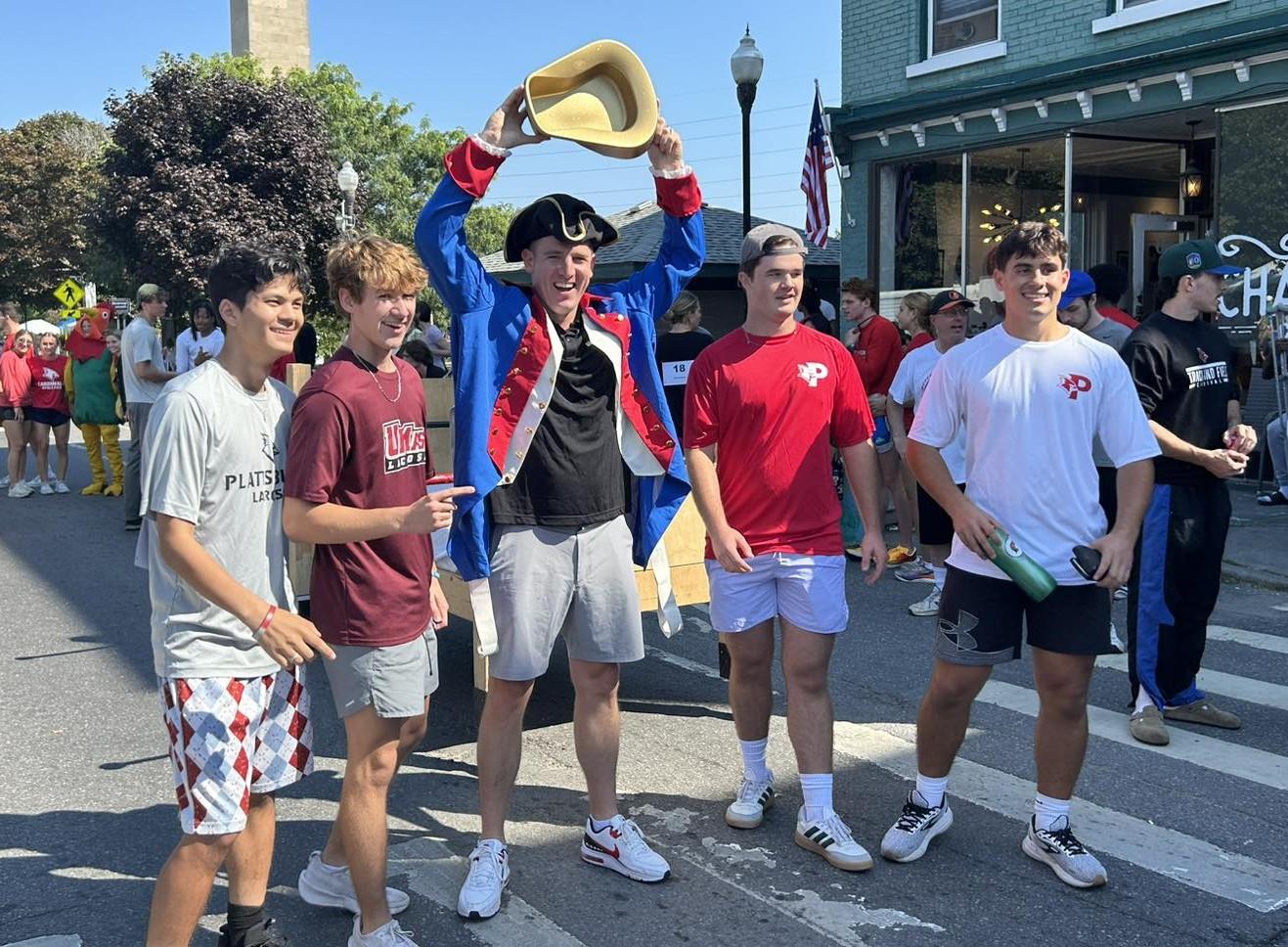Shea Brennan of Brennan Buick/GMC, with the pushing power of the Cardinals Men’s Lacrosse Team, traversed the finish line winning the “Industry” division.