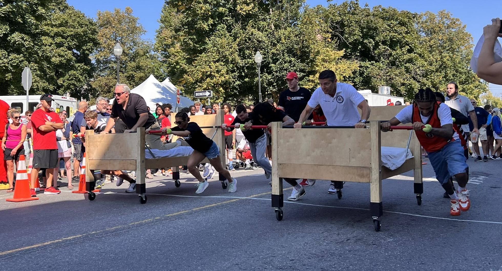 North Country's own State Senator Dan Stec and State Assemblyman Billy Jones race head-to-head in the Celebrity division of the annual Rotary Bed Races in Plattsburgh, Saturday, Sept. 14.
