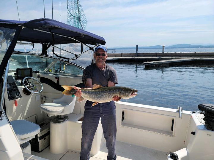 Roland Poulin of New Hampton, NH, took first place in the lake trout category with this 14 lb. 0.5 oz. catch.