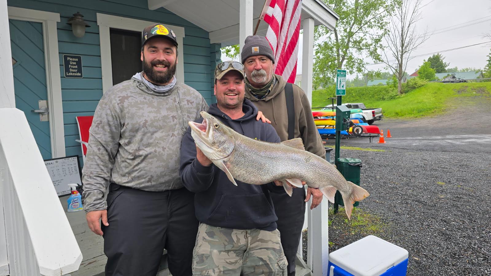 Three Contestants Posing with Fish