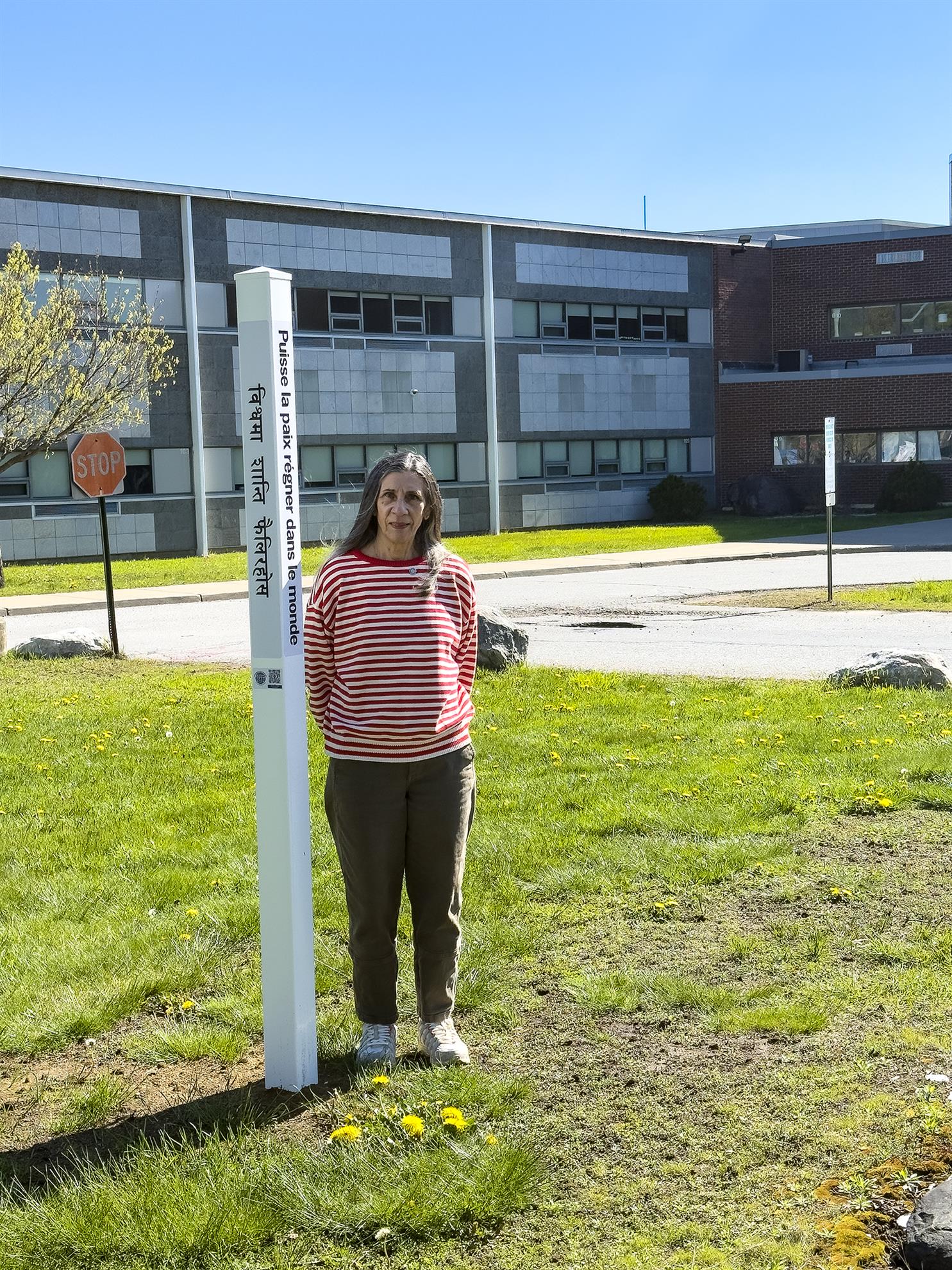 Nina Borden at Peace Pole in front of SBHS