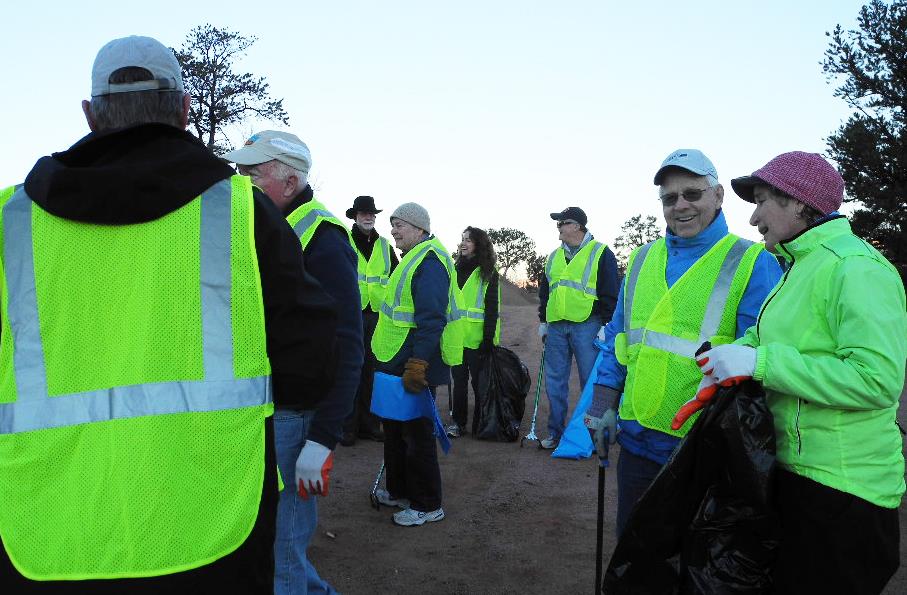 Members of the Rotary Clubs of Sedona and Sedona Red Rocks gather in early morning light to pick up litter on Hwy 89A